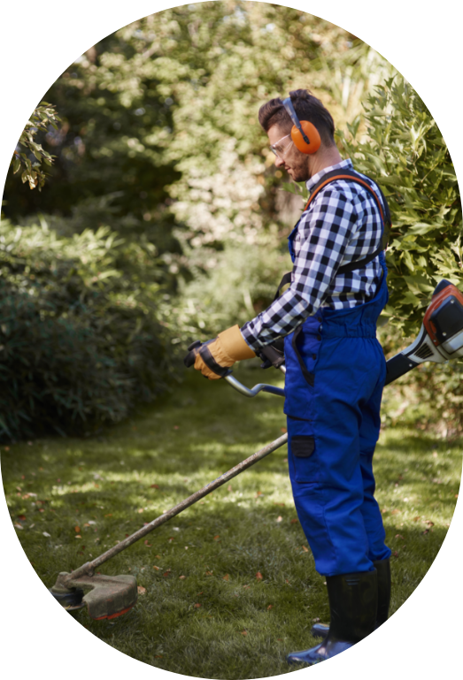busy-man-using-weedwacker-garden